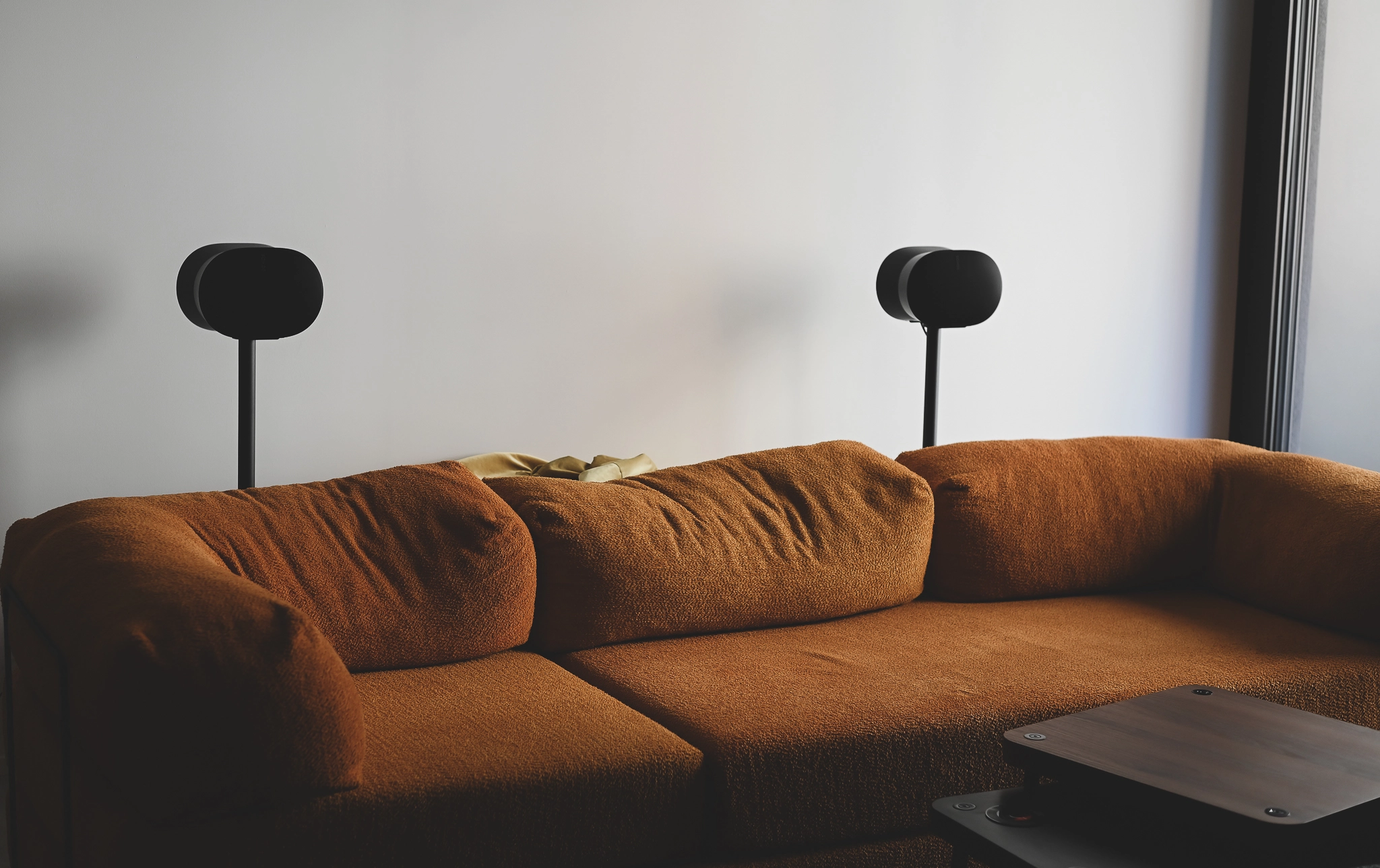 Two Sonos Era 300 speakers behind my sofa